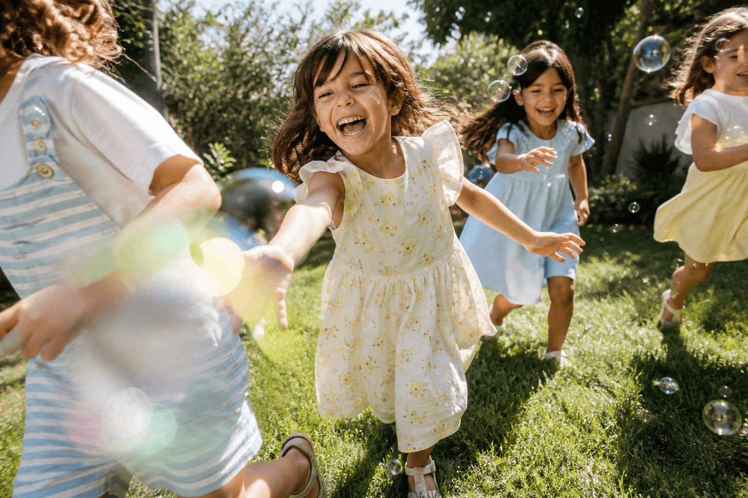 Children playing with bubbles outside