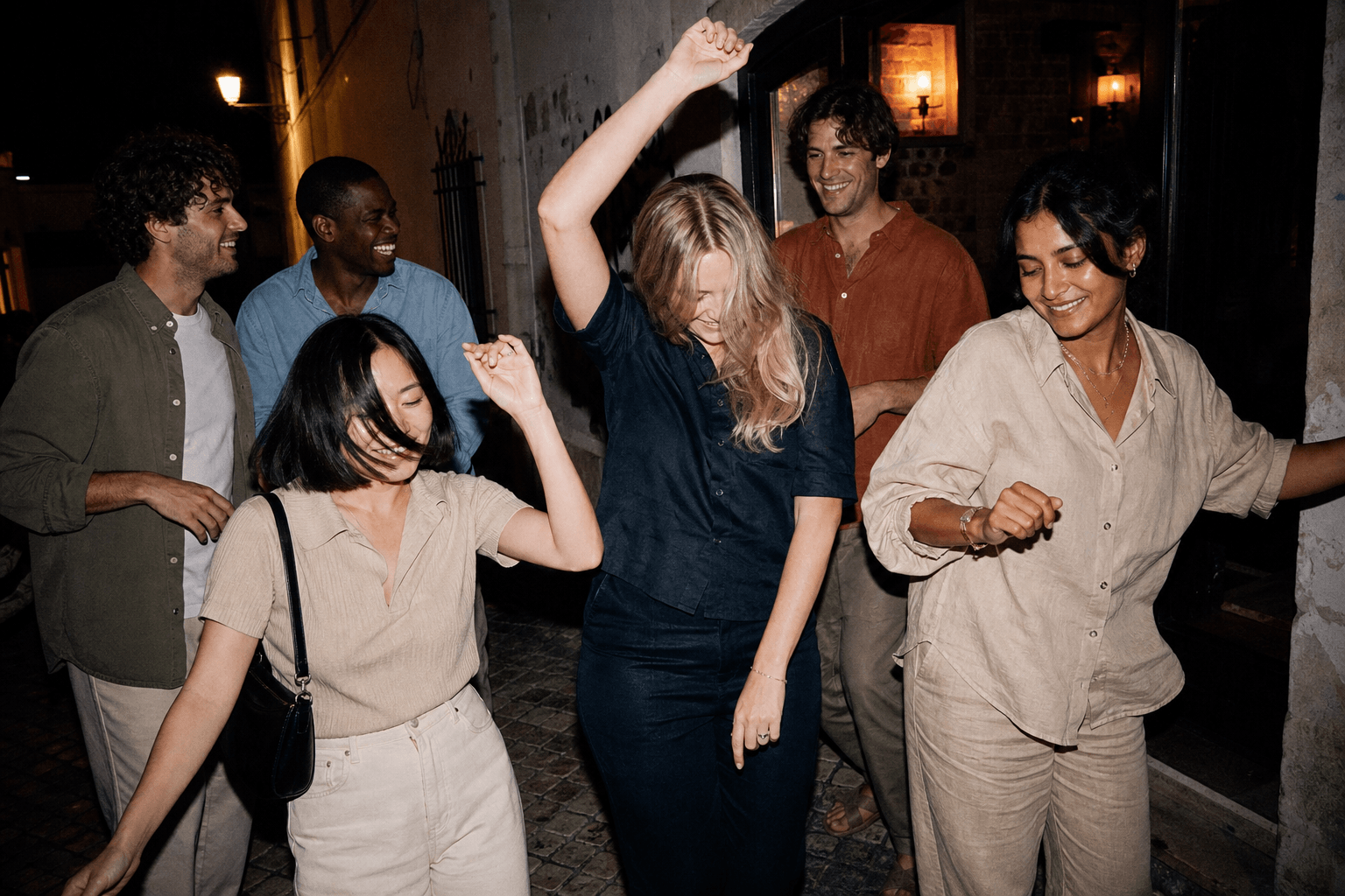 Friends dancing at night